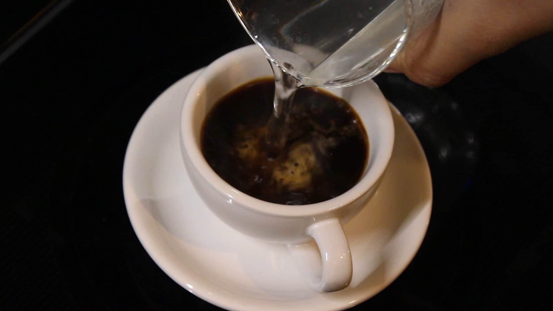 pouring warm water into the cup