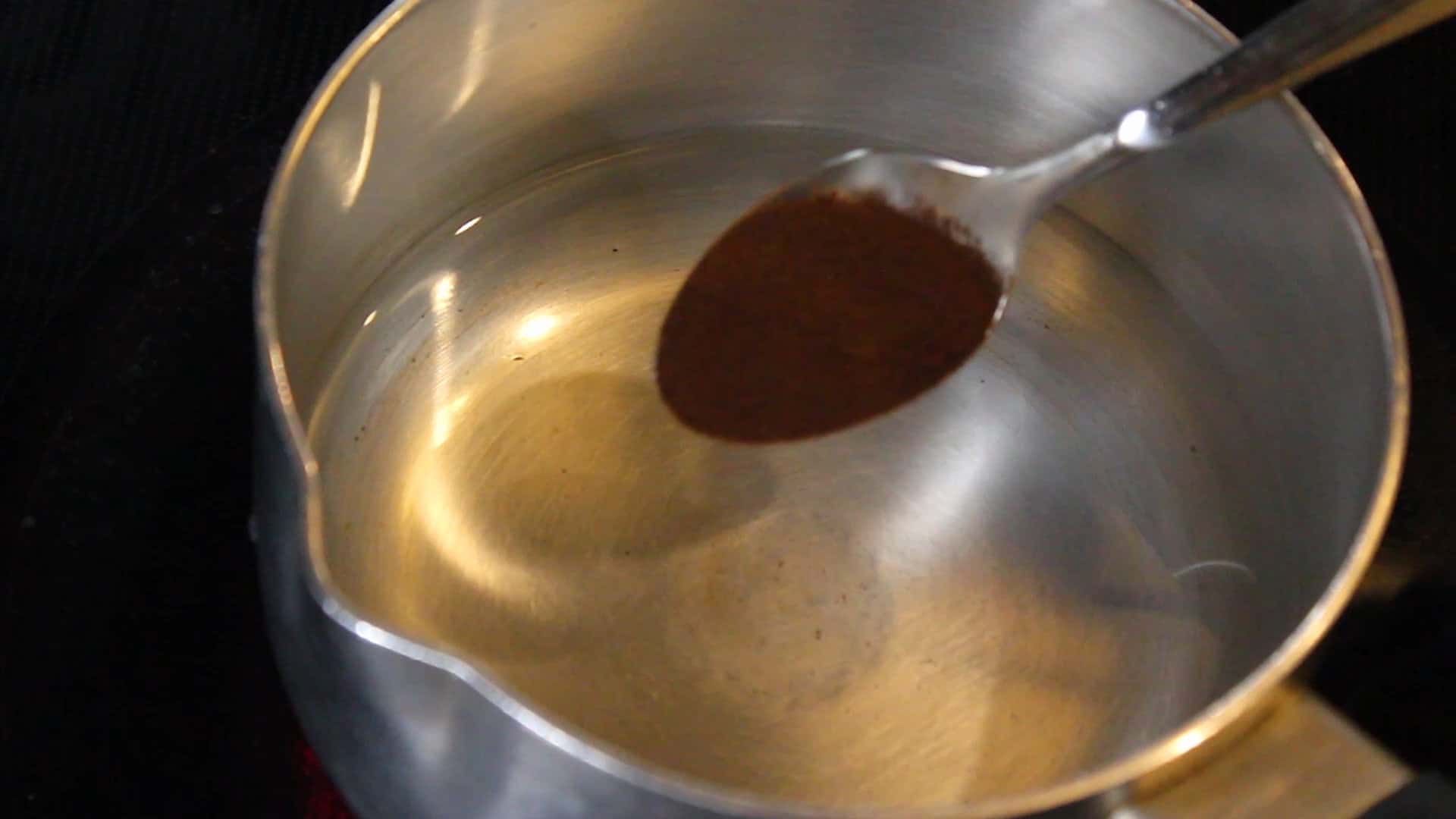 adding a teaspoon of instant black coffee powder 