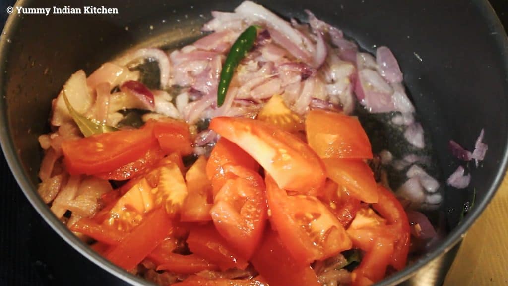 Adding chopped tomato, mix, add salt as per taste, add turmeric powder and mixing