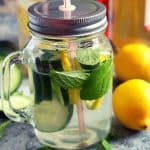 lemon cucumber slices with mint leaves infused water in a jar with a lid