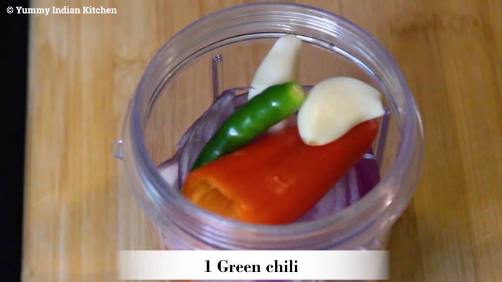  adding red bell peppers, sliced onion into a jar