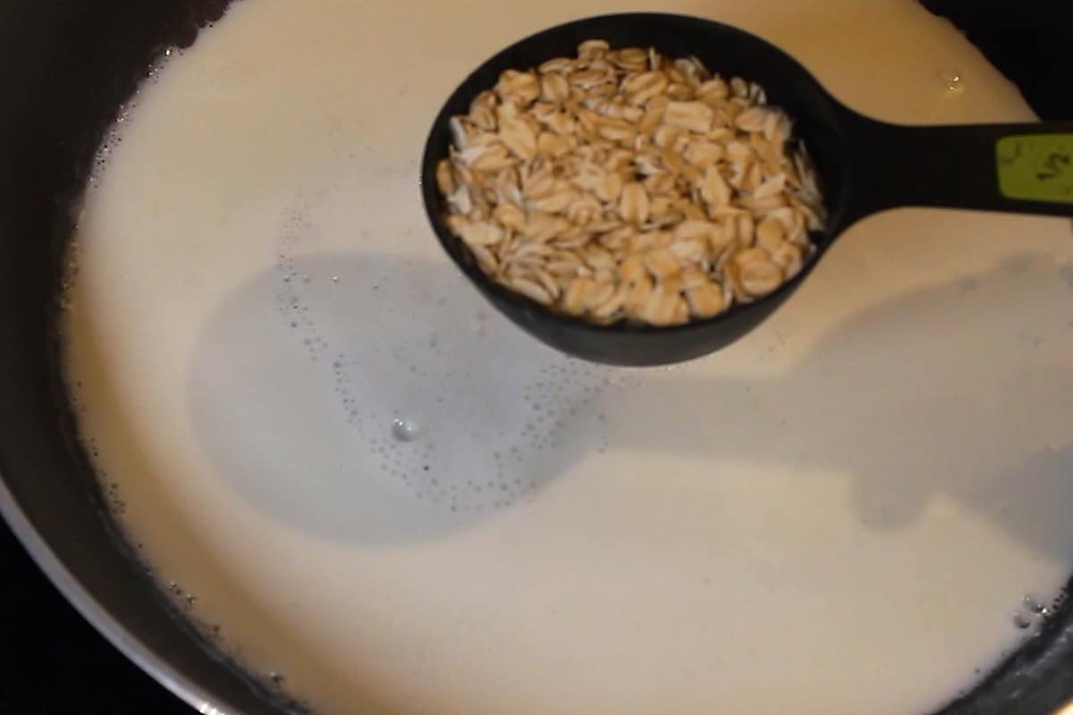 adding oats into the milk