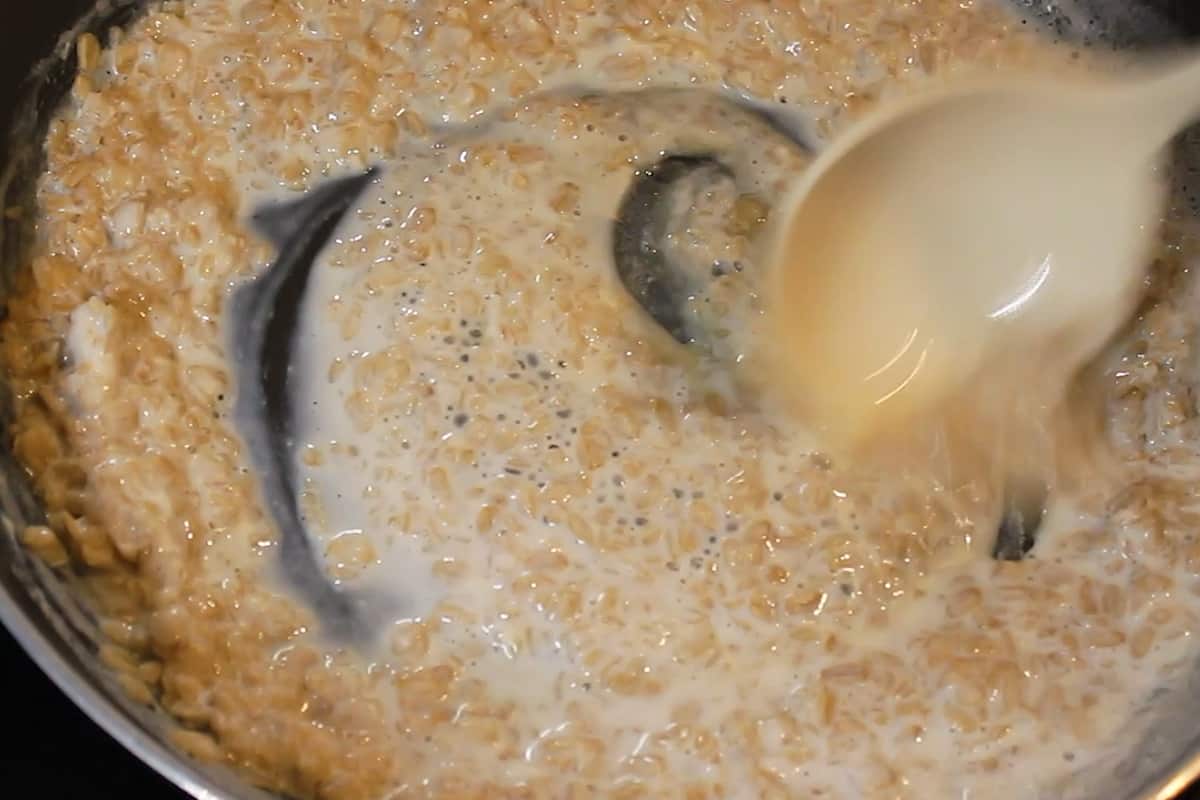mixing the honey with cooked oats