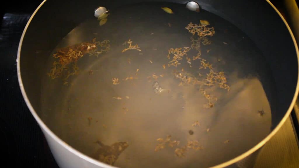  boiling water by adding whole spices, salt to taste, oil.