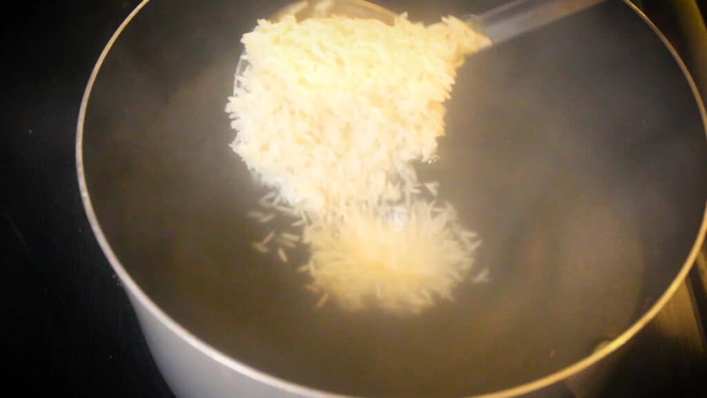 adding soaked basmati rice