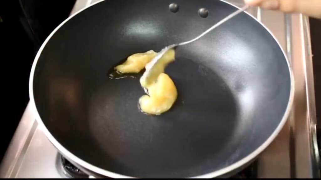 adding ghee to a pan