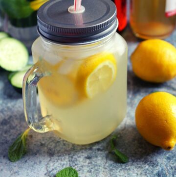 apple cider vinegar and lemon detox drink served in a mason jar