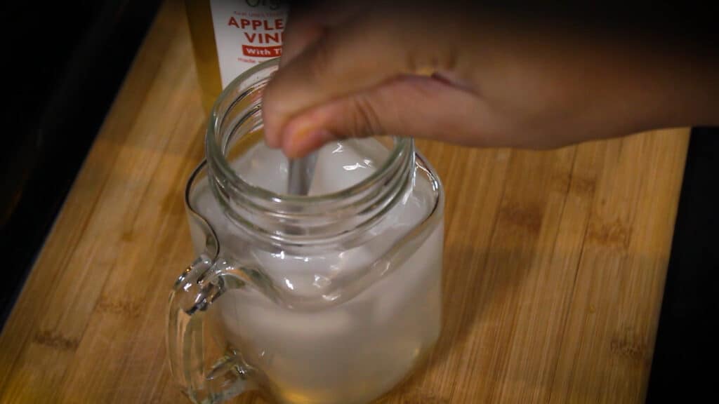 Stirring the apple cider vinegar and lemons juice