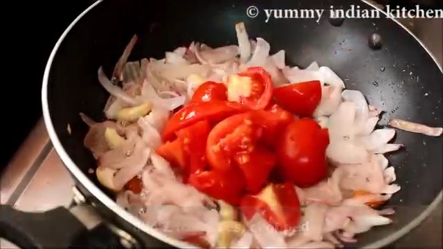 adding chopped tomatoes