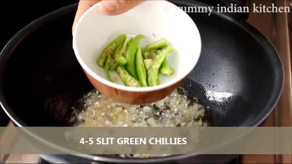  sauteing slit green chillies