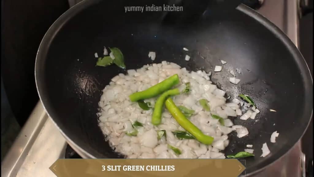 sauteing green chillies, onions, curry leaves in oil