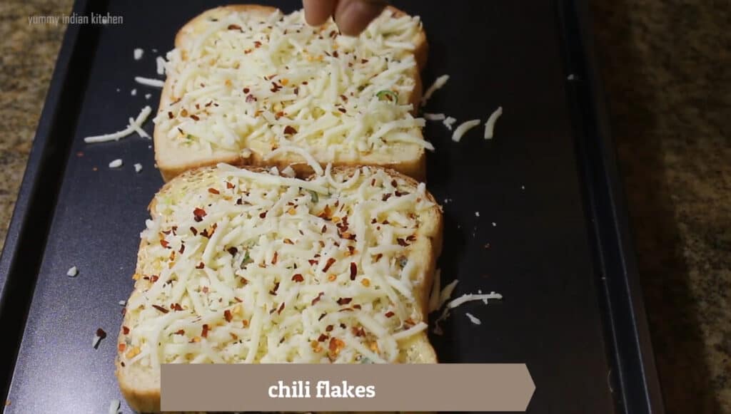 Sprinkling some chilli flakes on bread