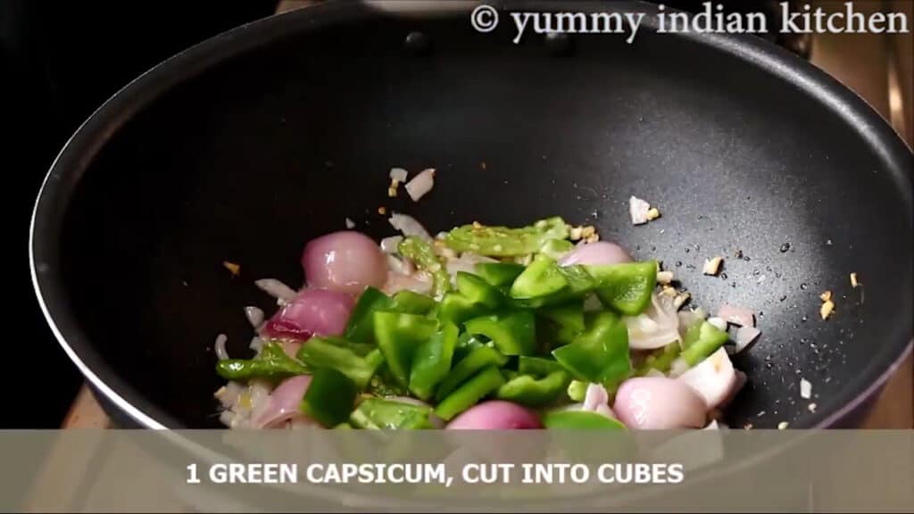 Adding onion and green capsicum cubes