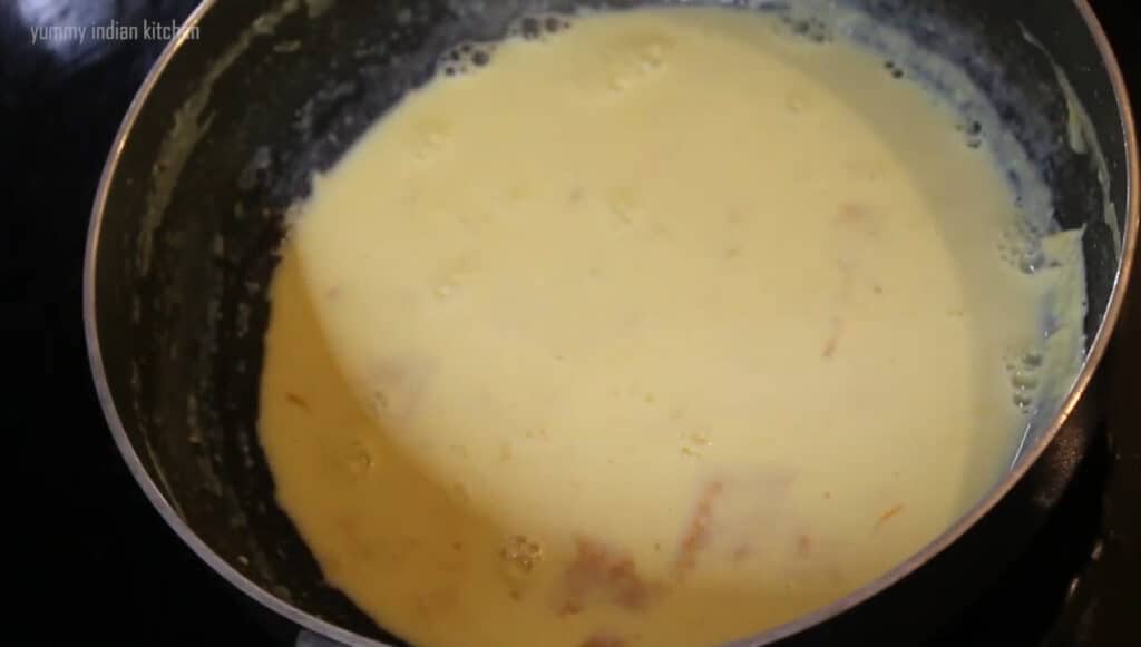 Stirring well and keep boiling it until the milk is reduced to half