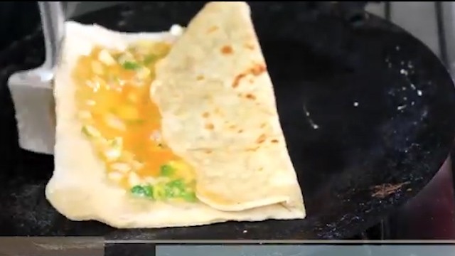 folding the roti from one side