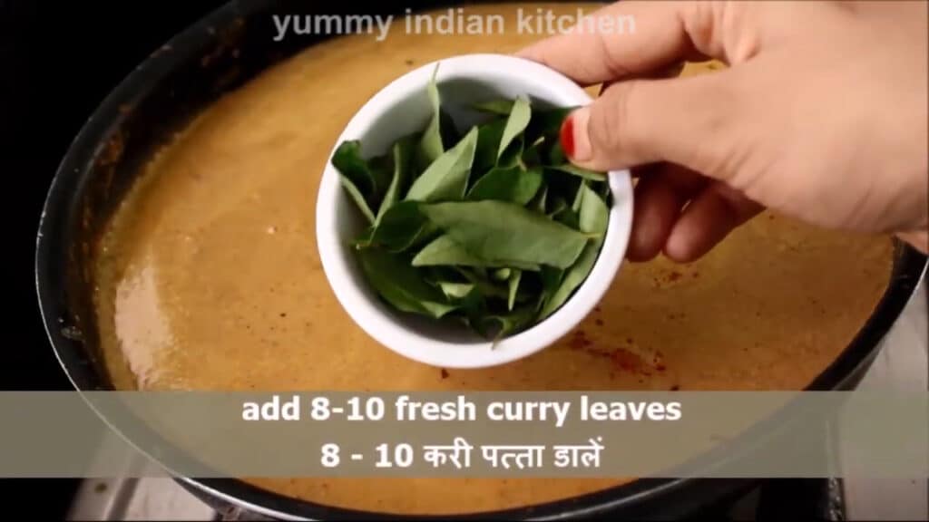 adding some fresh curry leaves