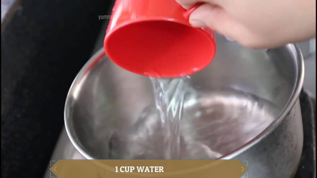 Adding a glass of water to the pan