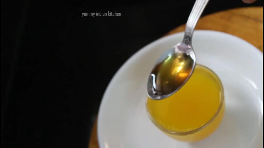 Adding honey to the drink 