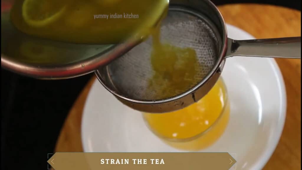 Straining and pouring the ginger tea