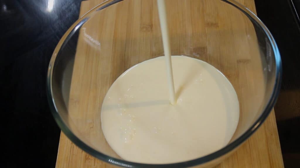 pouring a cup of whipping cream