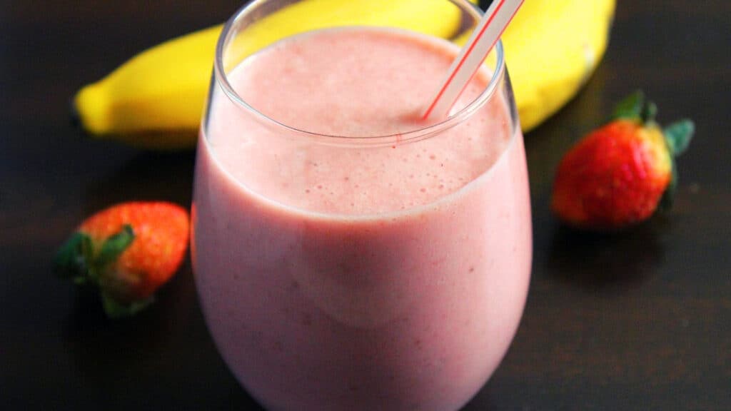 serving the Strawberry Banana Smoothie with yogurt