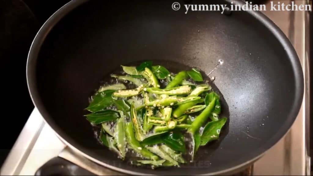 Adding curry leaves, green chillies