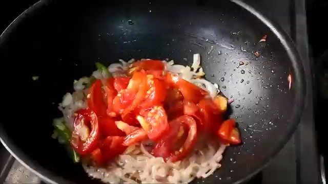 Adding chopped tomatoes