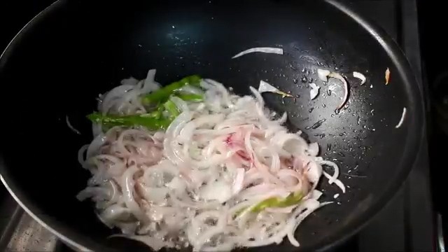 adding sliced onions and cooking