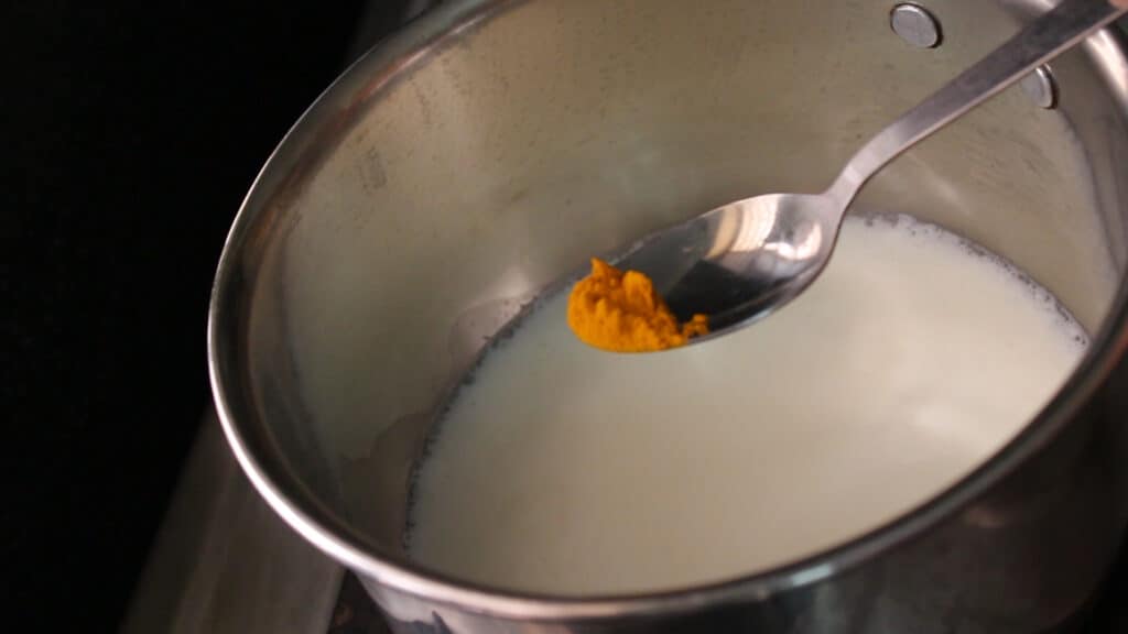 Adding the turmeric powder