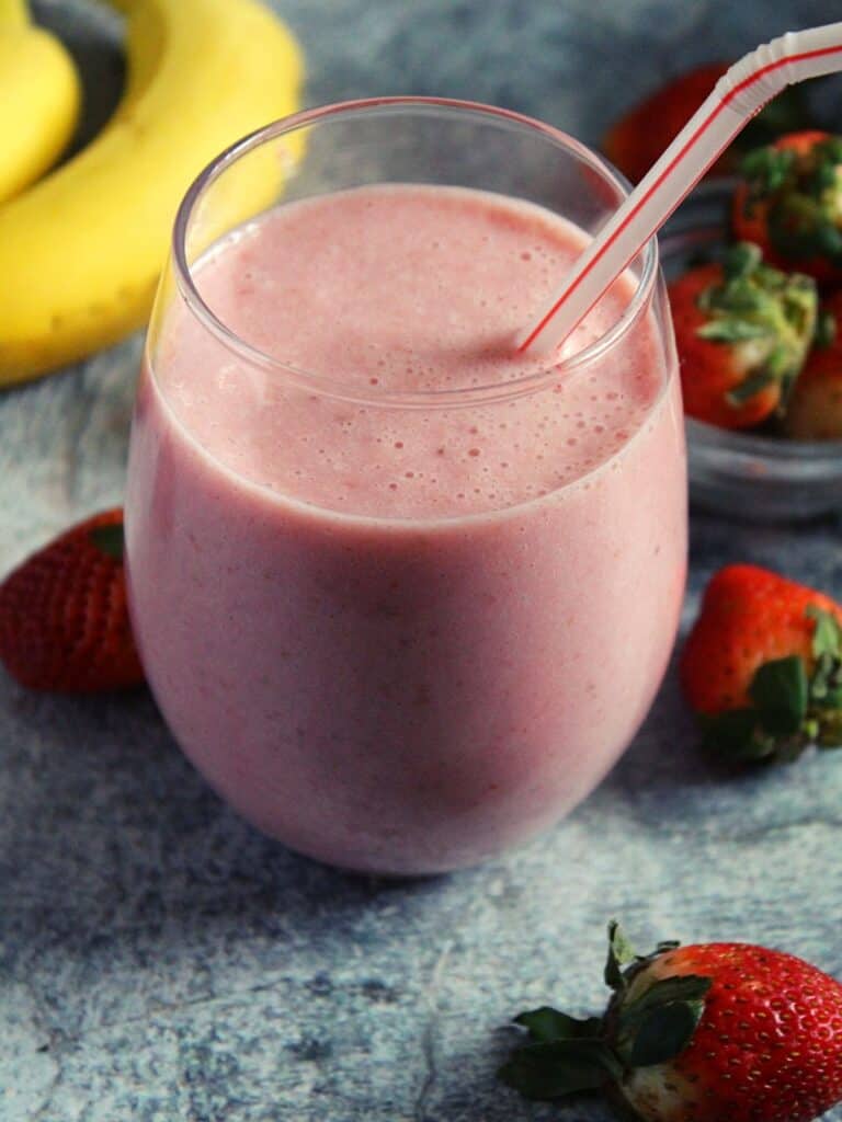 Mcdonald's Strawberry Banana Smoothie served in glass with a straw