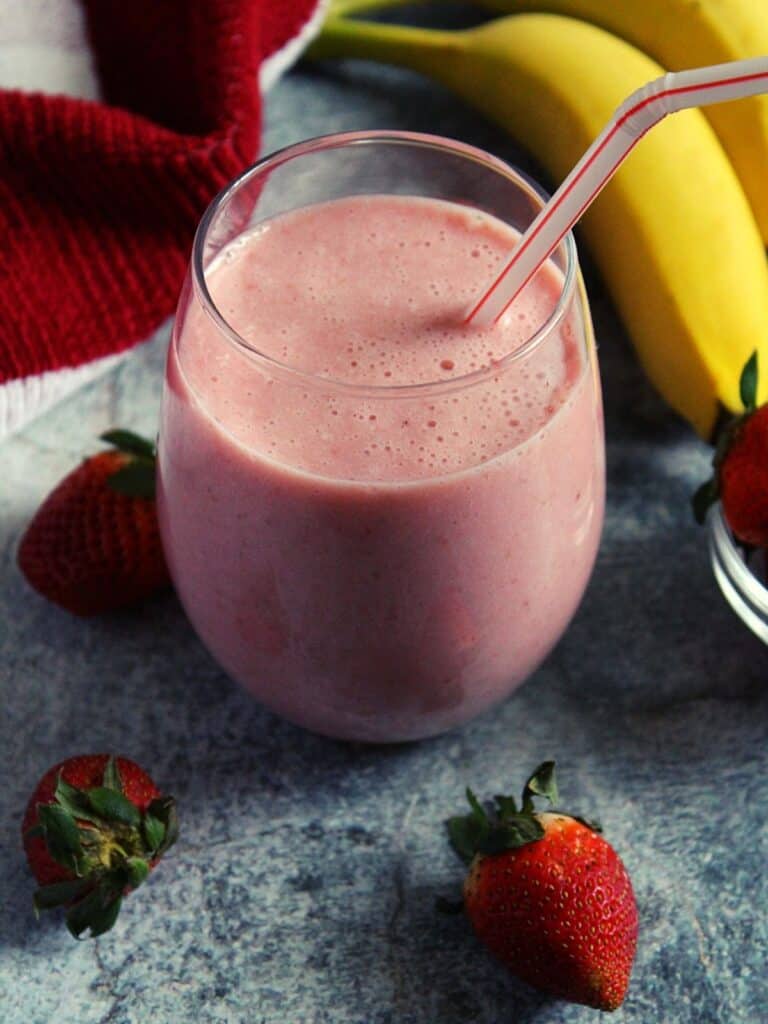 Mcdonald's Strawberry Banana Smoothie served in glass with a straw