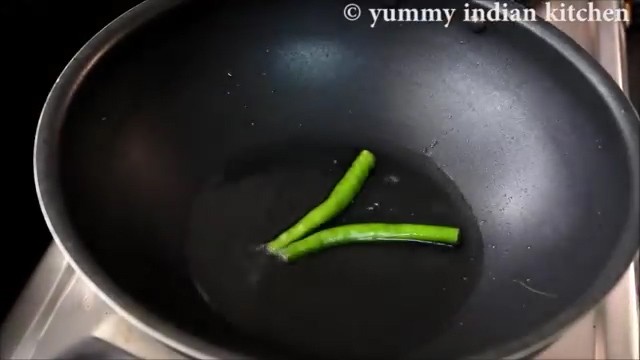 adding oil and adding slit green chillies