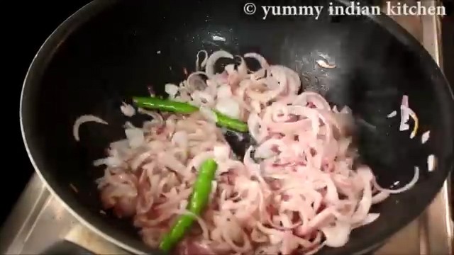 adding sliced onions and cook them until they turn soft