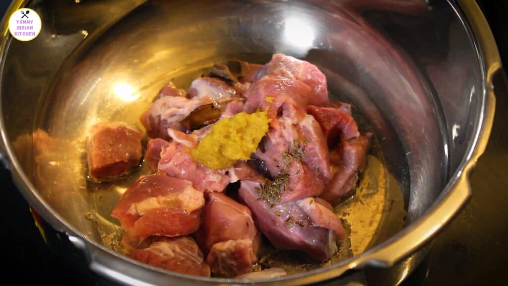 adding mutton and whole spices