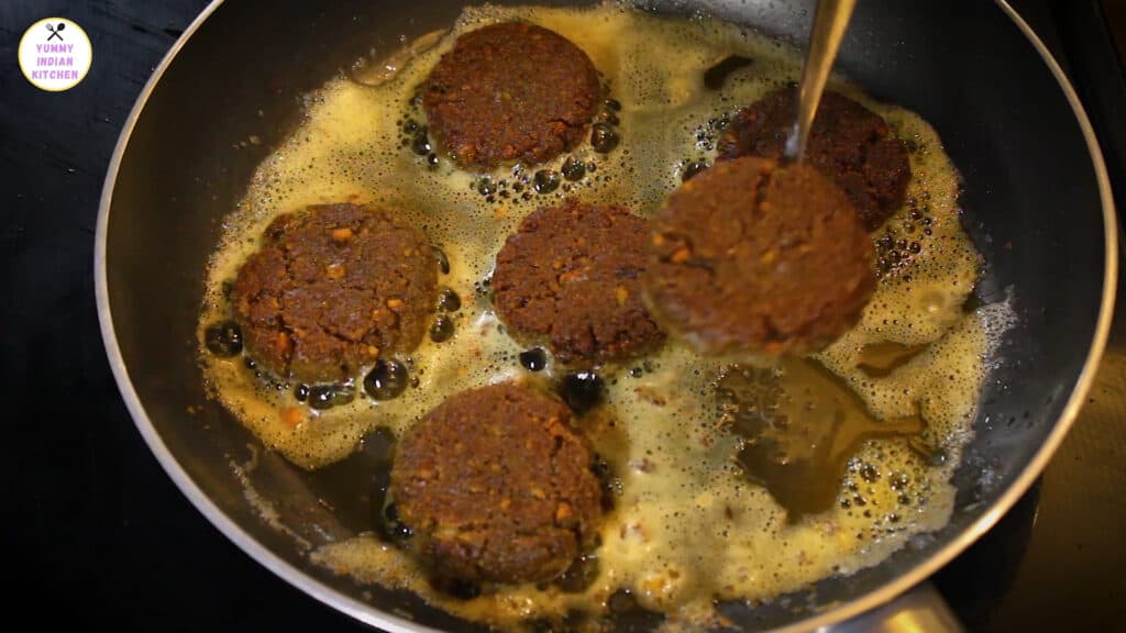 cooking both sides of the mutton shami kabab well 