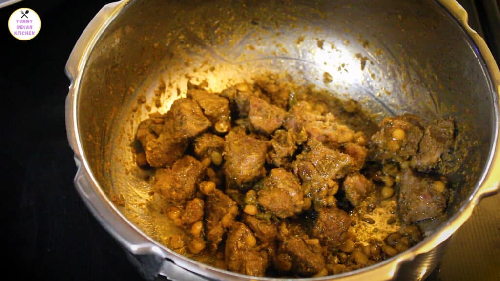 cooking the mutton until water completely absorbs
