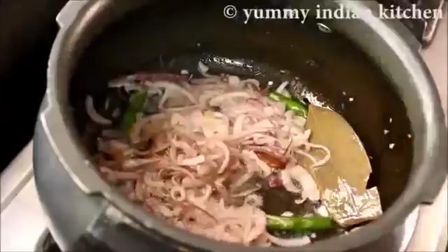 Adding sliced onions and cook them until onions turn soft