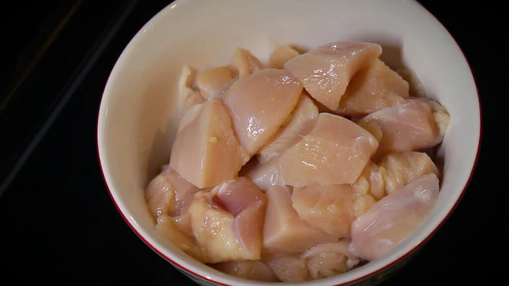 Taking boneless chicken pieces in a mixing bowl