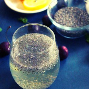 chia seeds soaked in water for weight loss and lemon slices placed in a small bowl