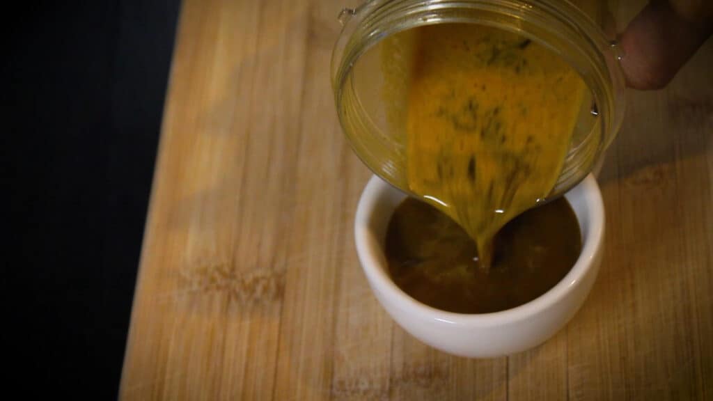 pouring the coffee into a cup