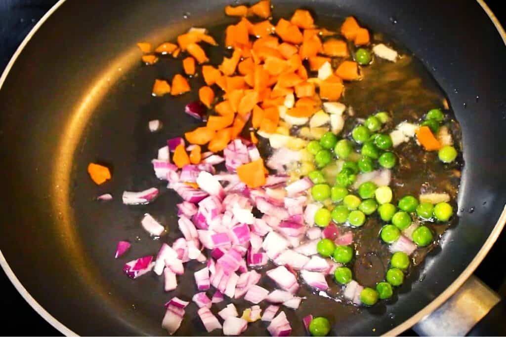 sauteing the veggies to make the fried rice