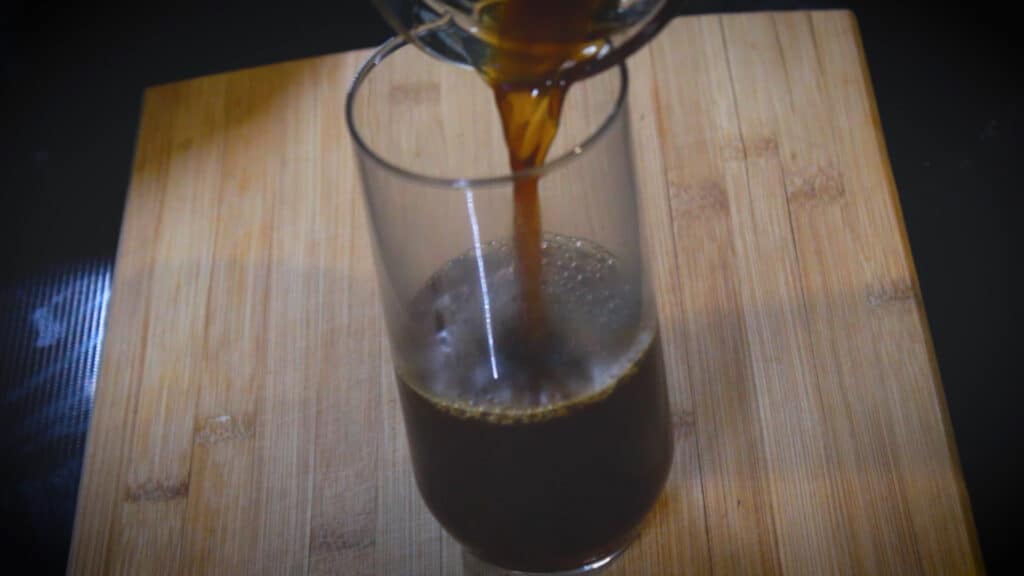  pouring chai concentrate into the glass