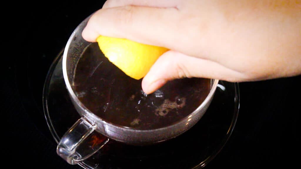 adding lemon drops into a cup