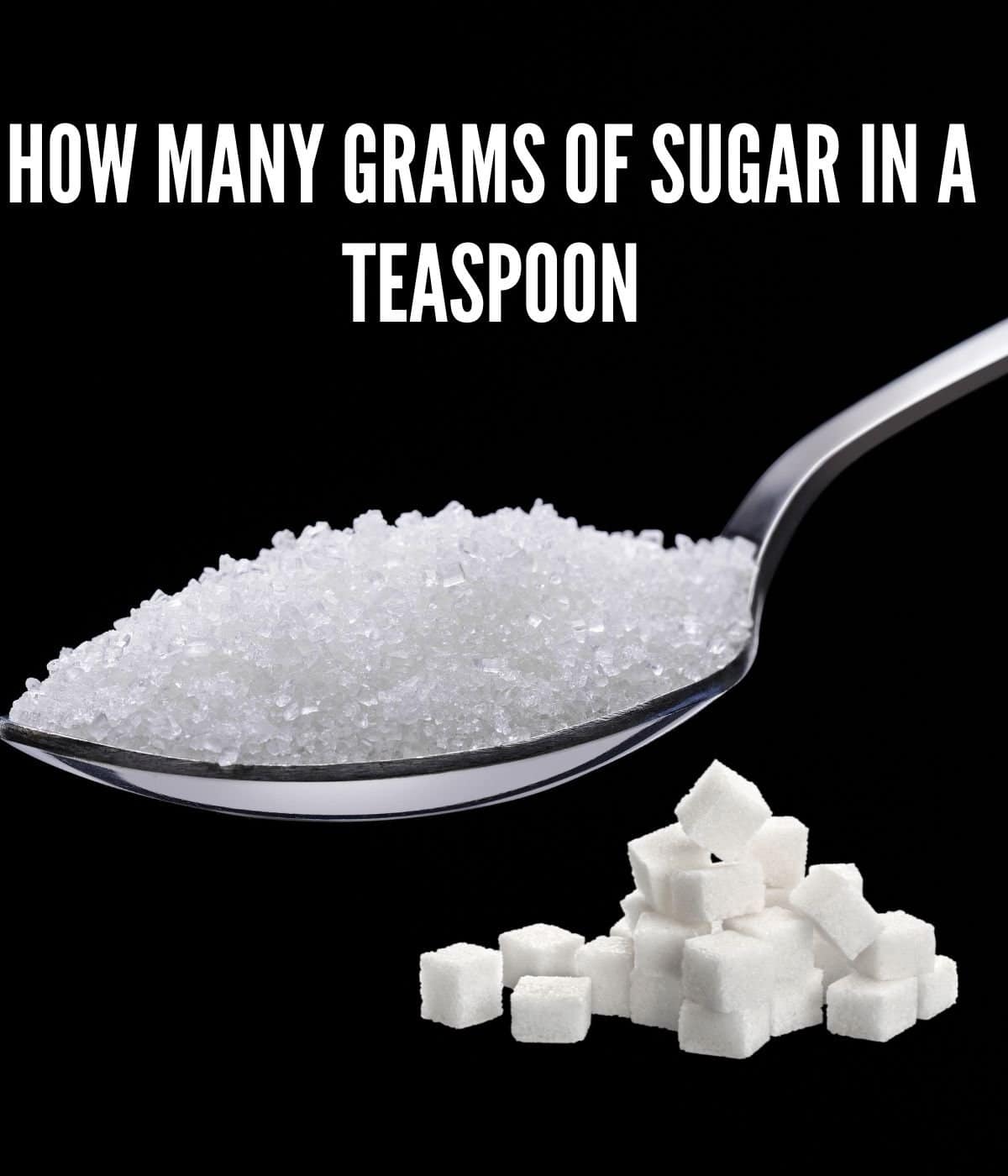 sugar in a teaspoon with sugar crystals at the bottom of the image