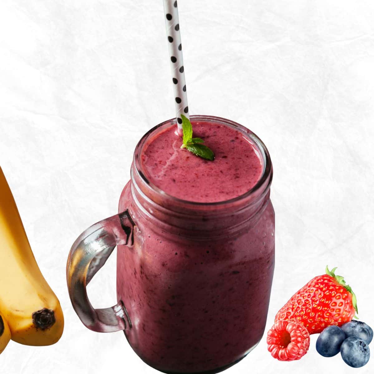 fruit smoothie recipe with yogurt in a mason jar with banana and berries shown beside the jar