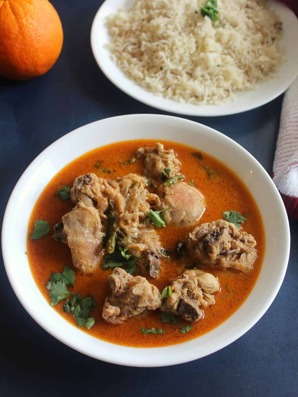 coconut chicken curry in indian style served in a bowl with rice