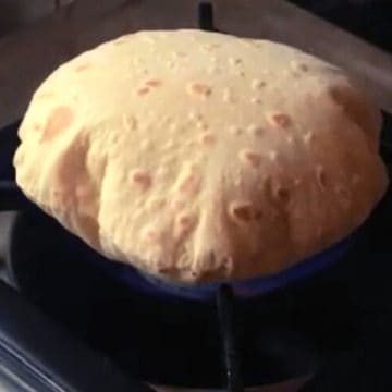puffed roti commonly called phulka on the stove
