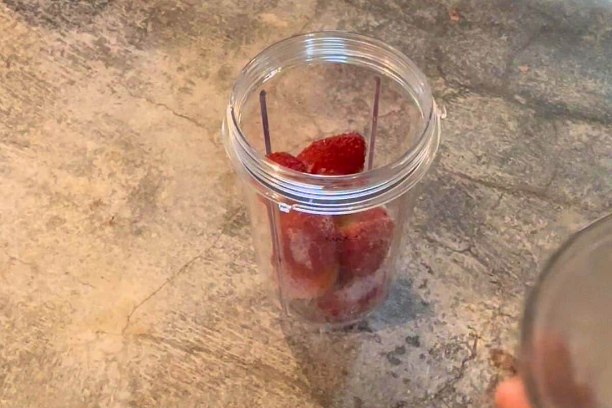 strawberries added to the blending jar